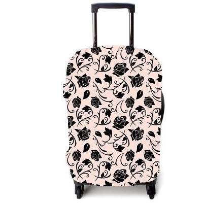 Funda maleta con flores negras sobre fondo rosa